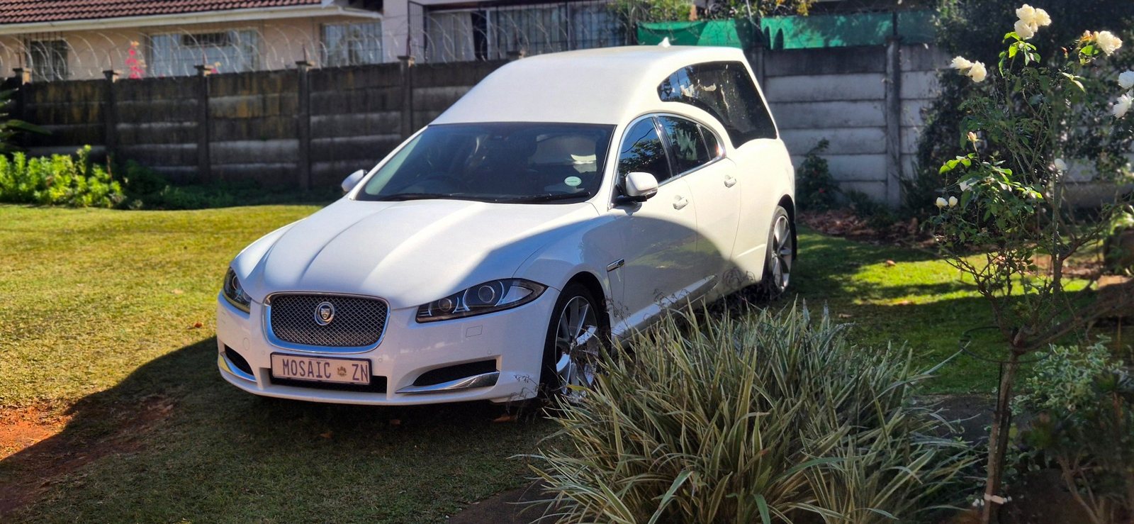 White Jaguar hearse